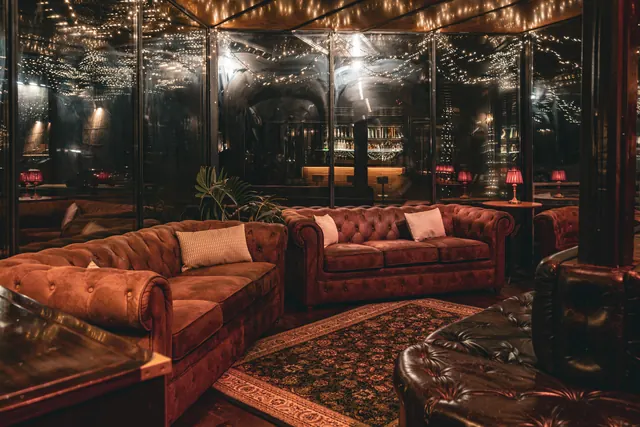 Chesterfield sofas and warm lighting for private business events